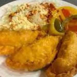 A plate of empanadas and rice on a table.