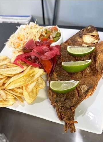 A plate with a fish and chips on it.